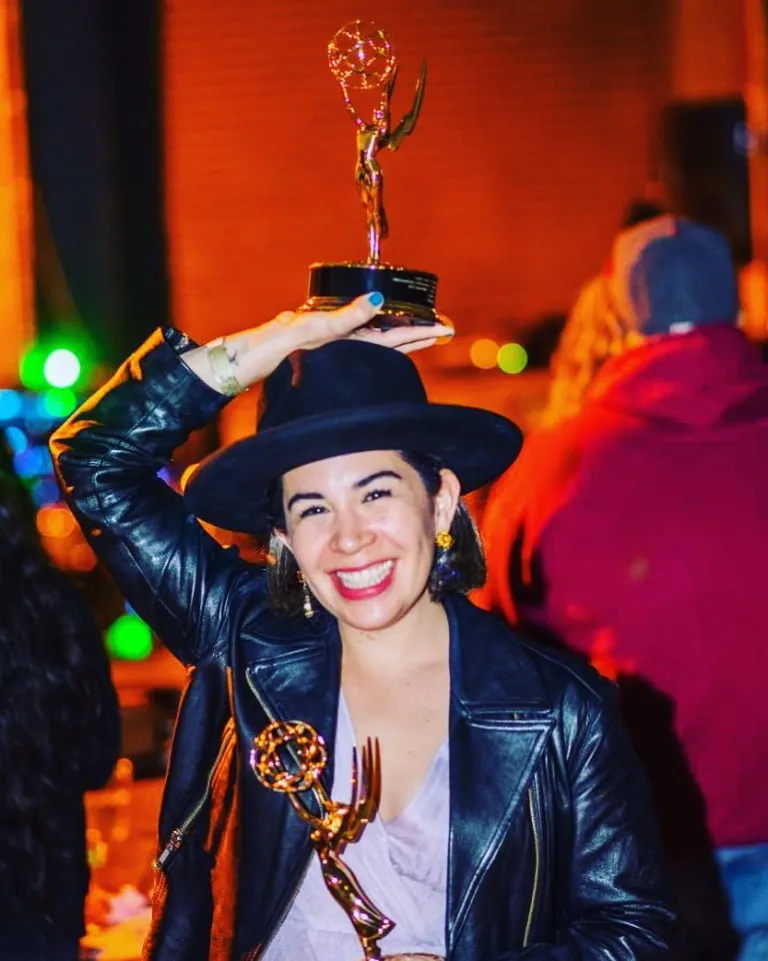 Pauline Castro with an Emmy award