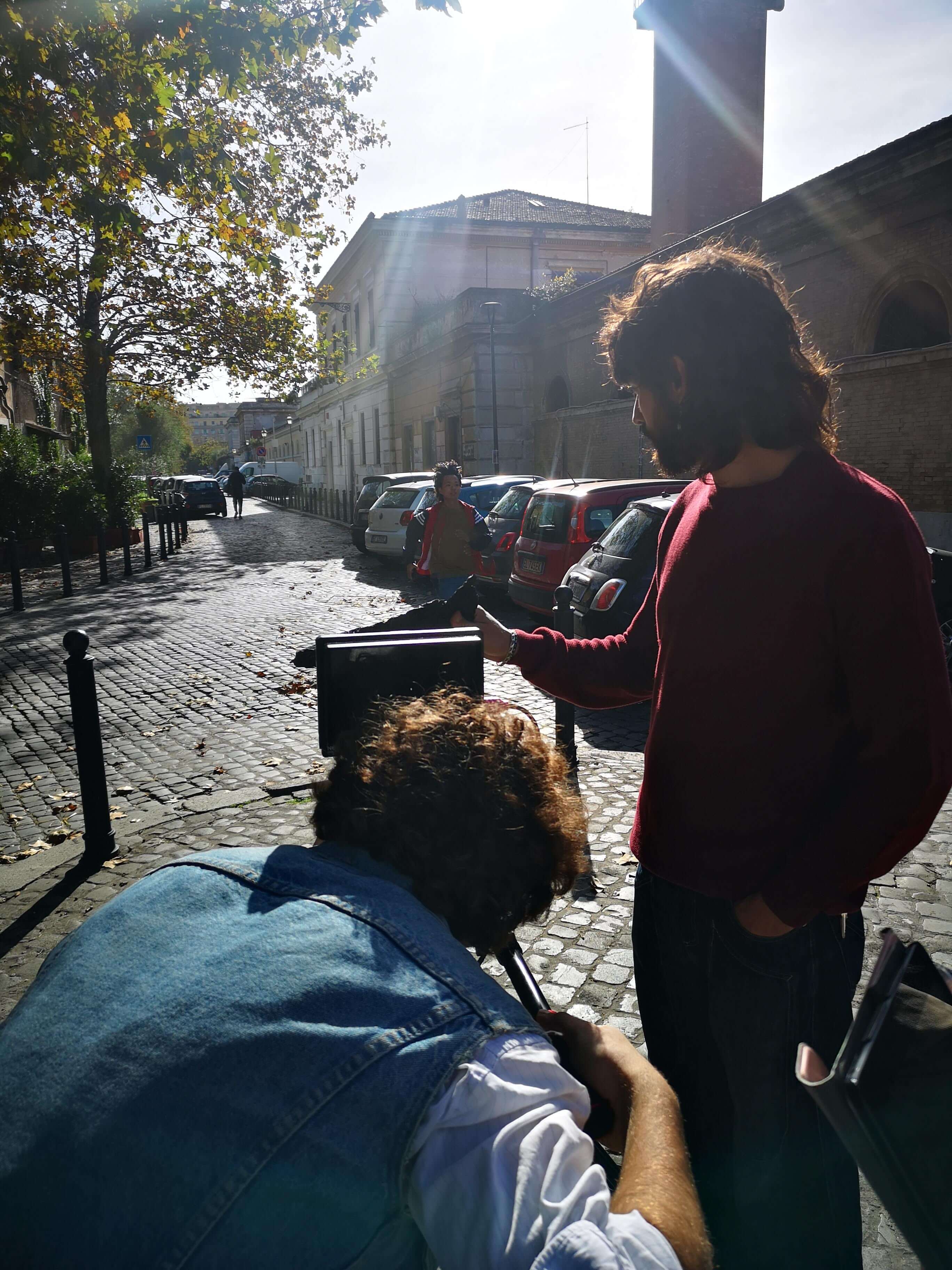 Two students on set looking into a camera 