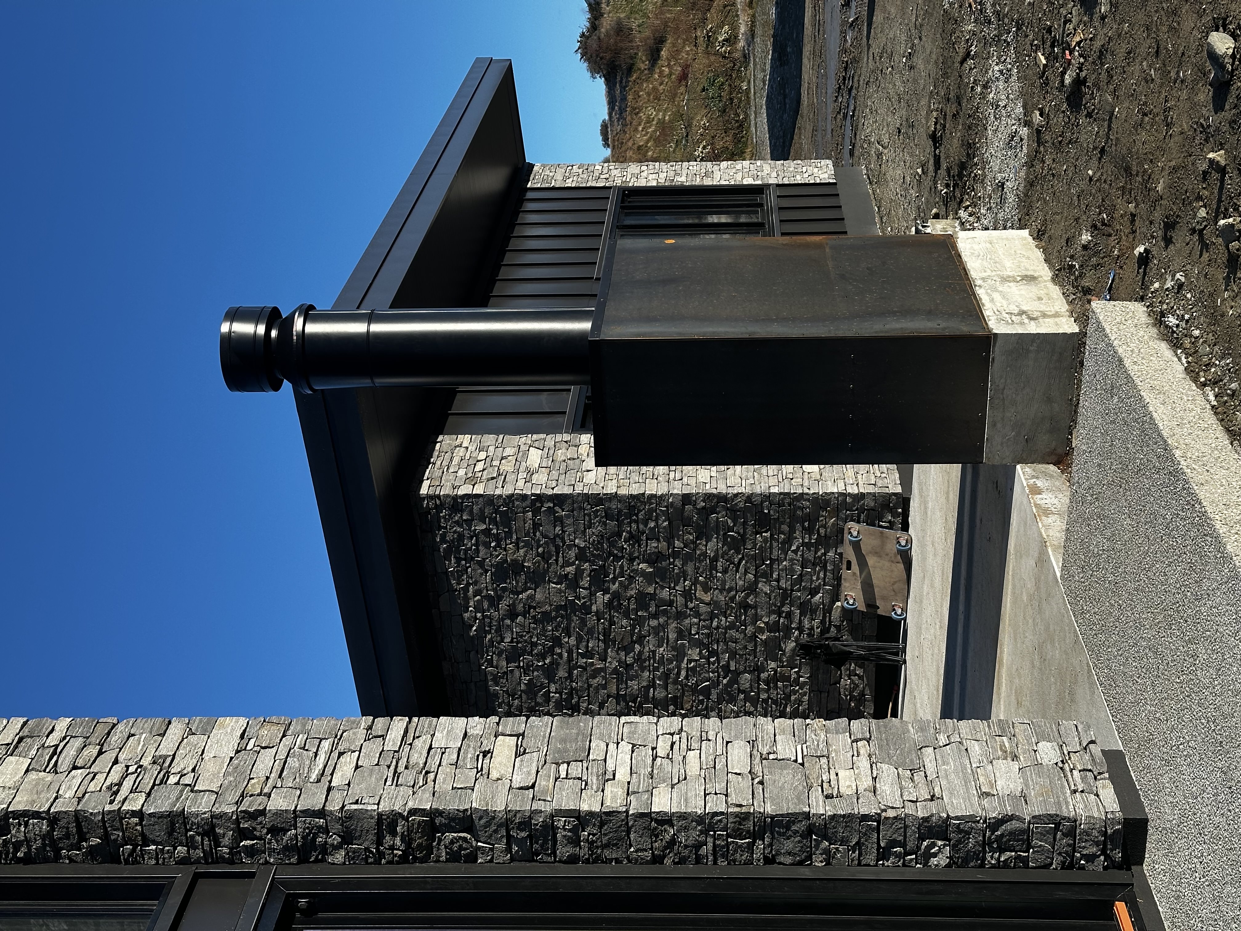 Completed entry with schist veneer columns