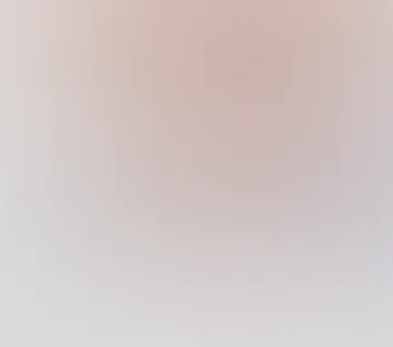 Blurred gradient background with soft hues of beige, pink, and gray.