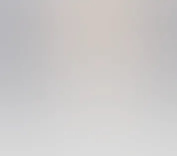 Abstract soft gradient background with muted pastel colors blending smoothly.