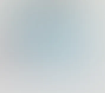 Blurred gradient background with soft blue and gray tones.