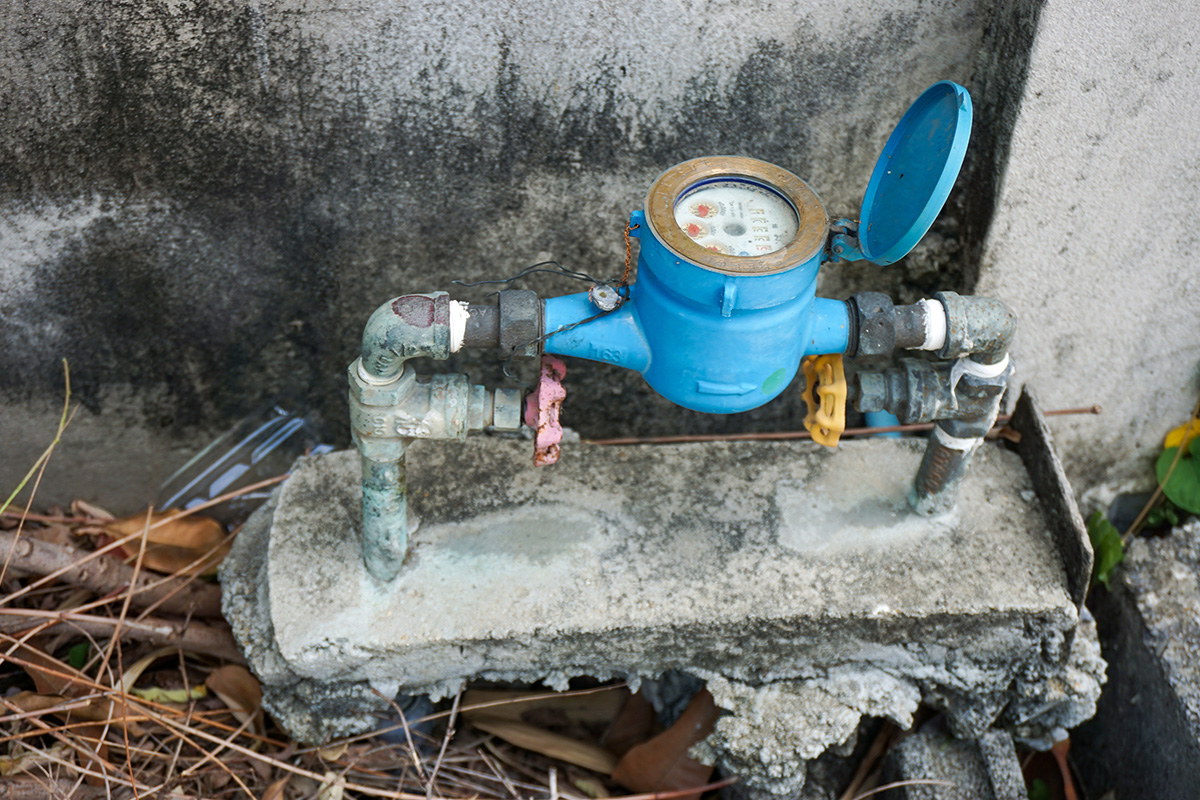 An open blue water meter outside of a house in Melbourne, Victoria.