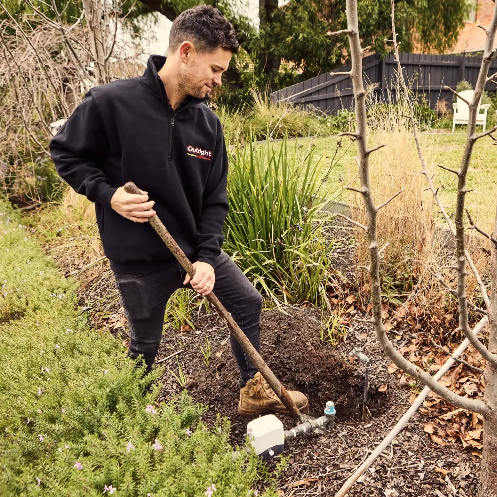 A plumber getting ready to install or maintain a rainwater system