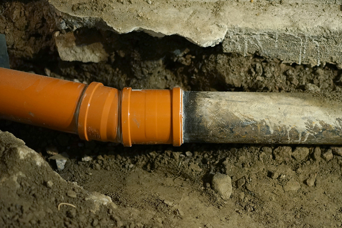 A secure joint between an old cast iron pipe and a new PVC pipe. This is one of the plumbing solutions we carried out for a Melbourne home where pipes had burst beneath the house.