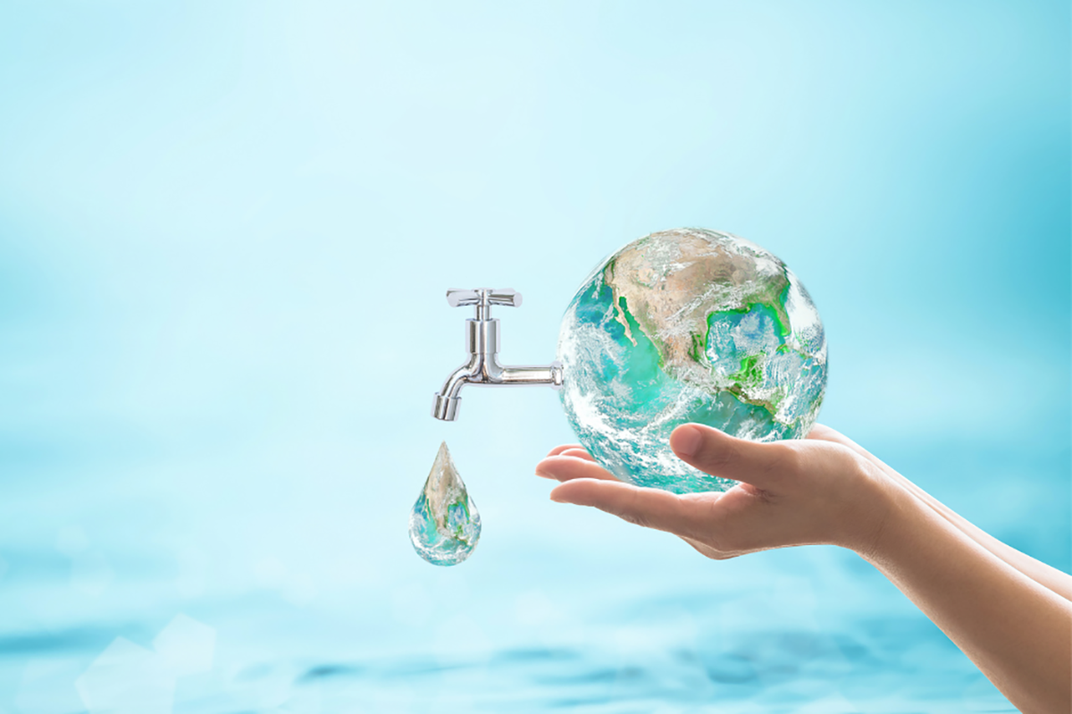 A graphic image of a water bubble containing the Earth within it. There’s a faucet tapped into it, from which a large drop of water is pouring out. The image gets across the idea that the Earth’s water is a finite resource that can be wasted, one drop at a time.