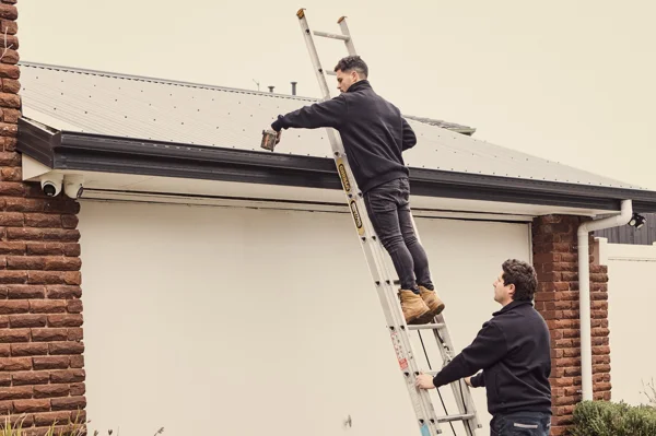 Plumber checking roof plumbing