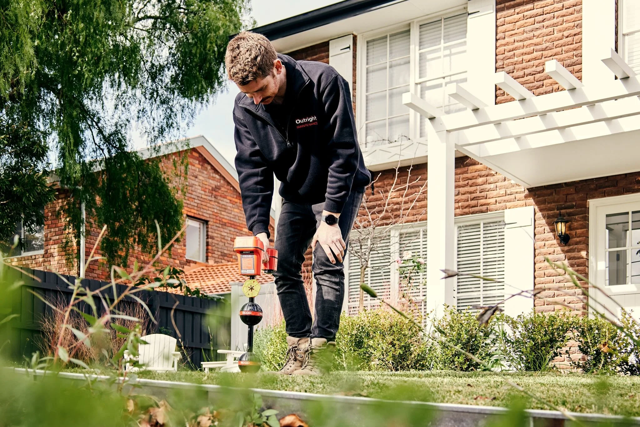 Pat from Outright Plumbing Locating a Drain with Tools