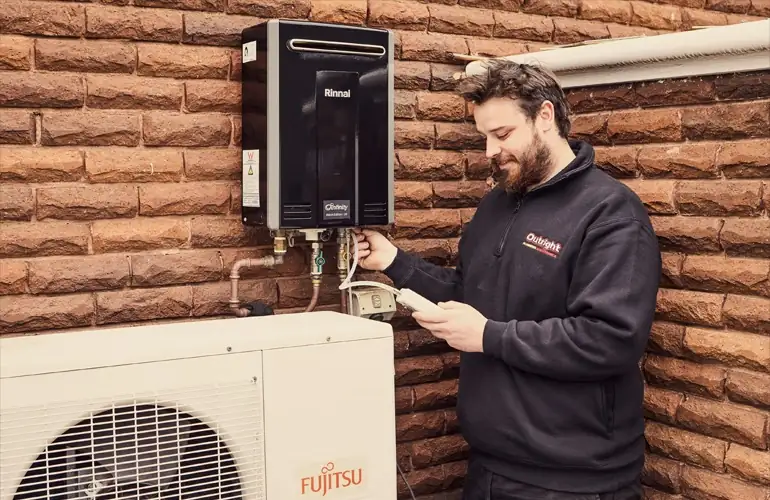 Outright Plumbing staff member doing general plumbing maintenance