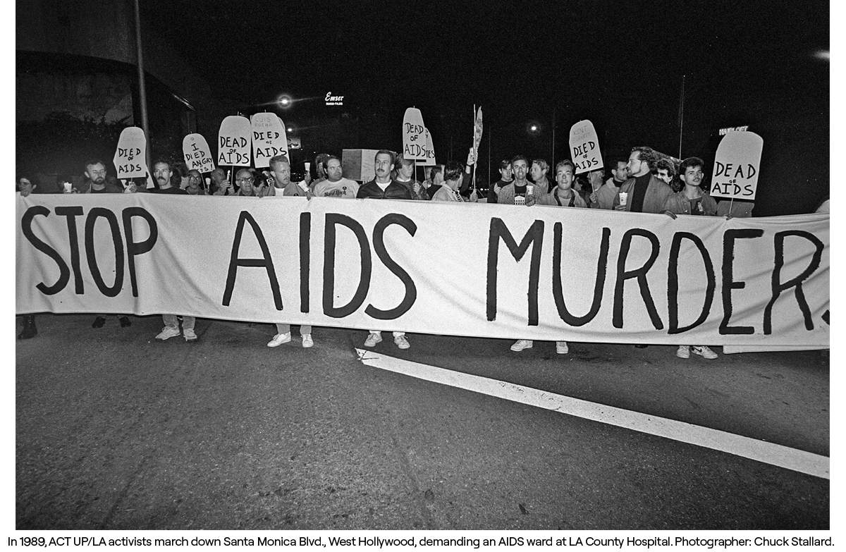 In 1989, ACT UP/LA activists march down Santa Monica Blvd., West Hollywood, demanding an AIDS ward at LA County Hospital. Photographer: Chuck Stallard.
