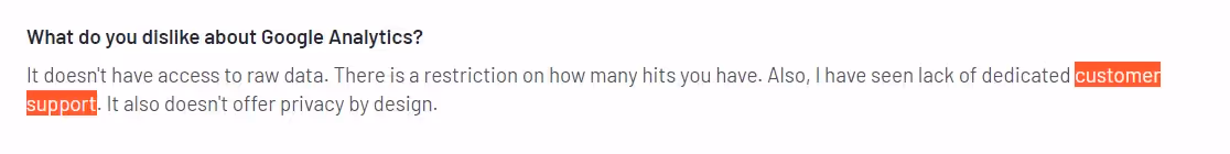 A snippet from a user review for GA4 on g2, criticizing GA4’s customer support.