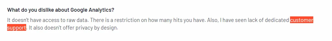 A snippet from a user review for GA4 on g2, criticizing GA4’s customer support.