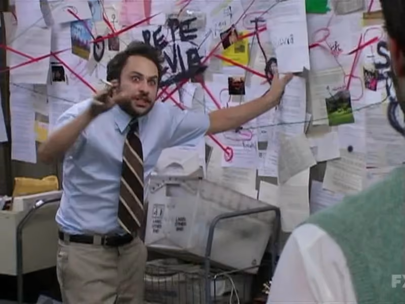 Charlie Kelly meme where he's in a shirt and tie, standing in front of a wall