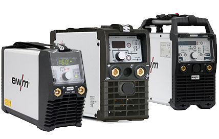 Three different EWM welding machines arranged side by side on a white background.