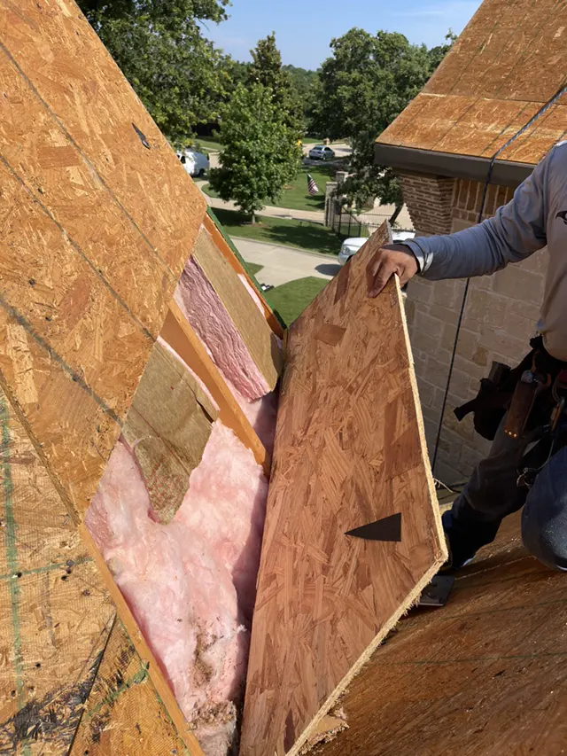 CLC Roofing team installing roof decking and insulation during a metal roofing project in Southlake, TX.