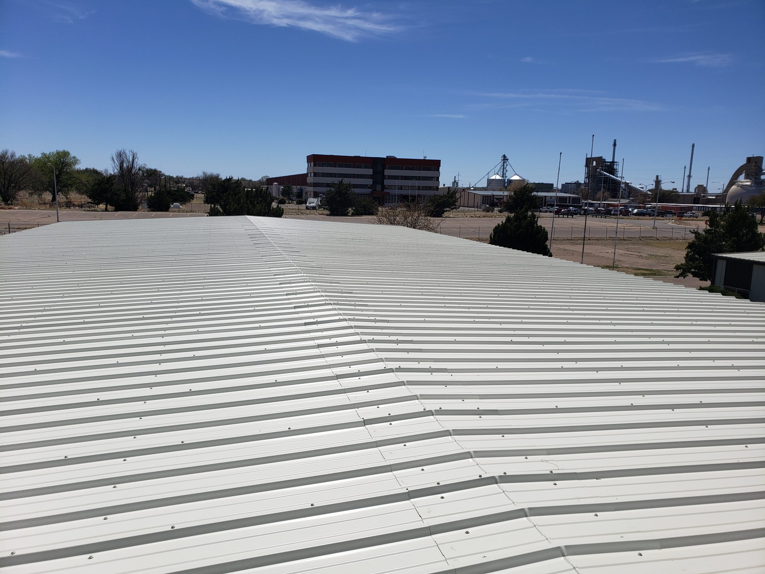 Large white metal roof installation in Southlake, TX, completed by CLC Roofing for durability and long-lasting performance.