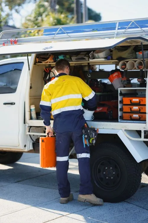 an electrician working out of his work vehicle