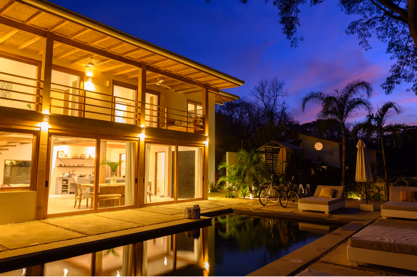 Apartment complex exterior with maintained landscaping, walkways, and clean residential access