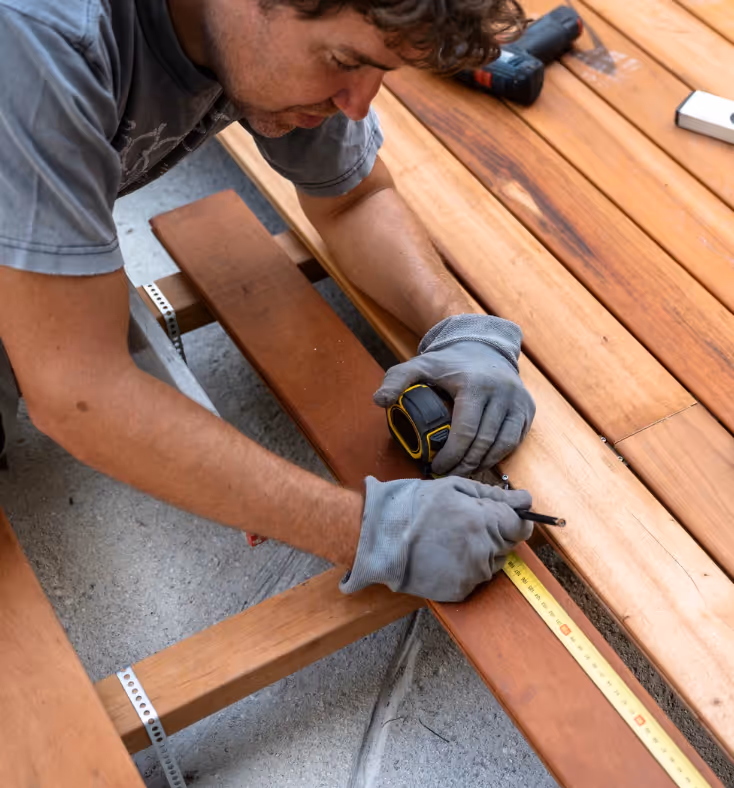 power washing walkway near landscaped area for exterior surface maintenance