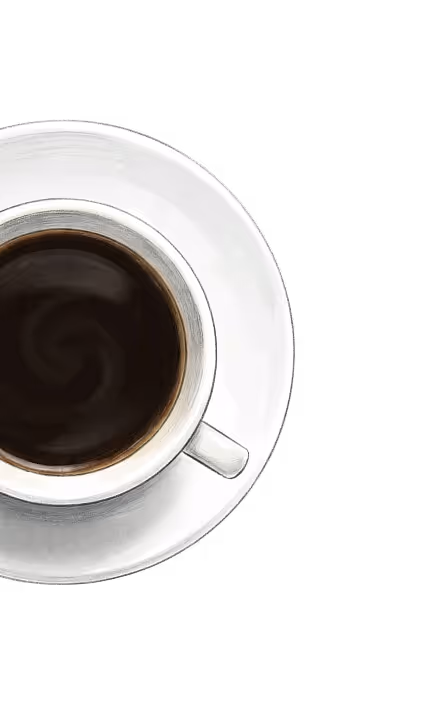 White cup filled with black coffee on a matching white saucer viewed from above.