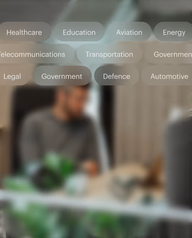 blurry image of a man working with a computer