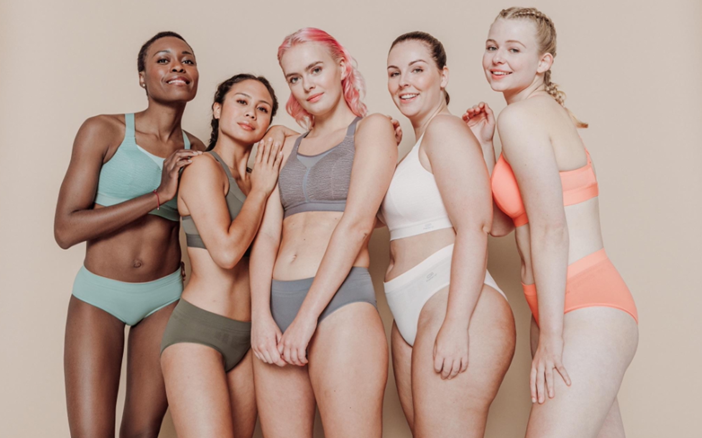 Diverse women in colorful underwear posing together for Decathlon brand