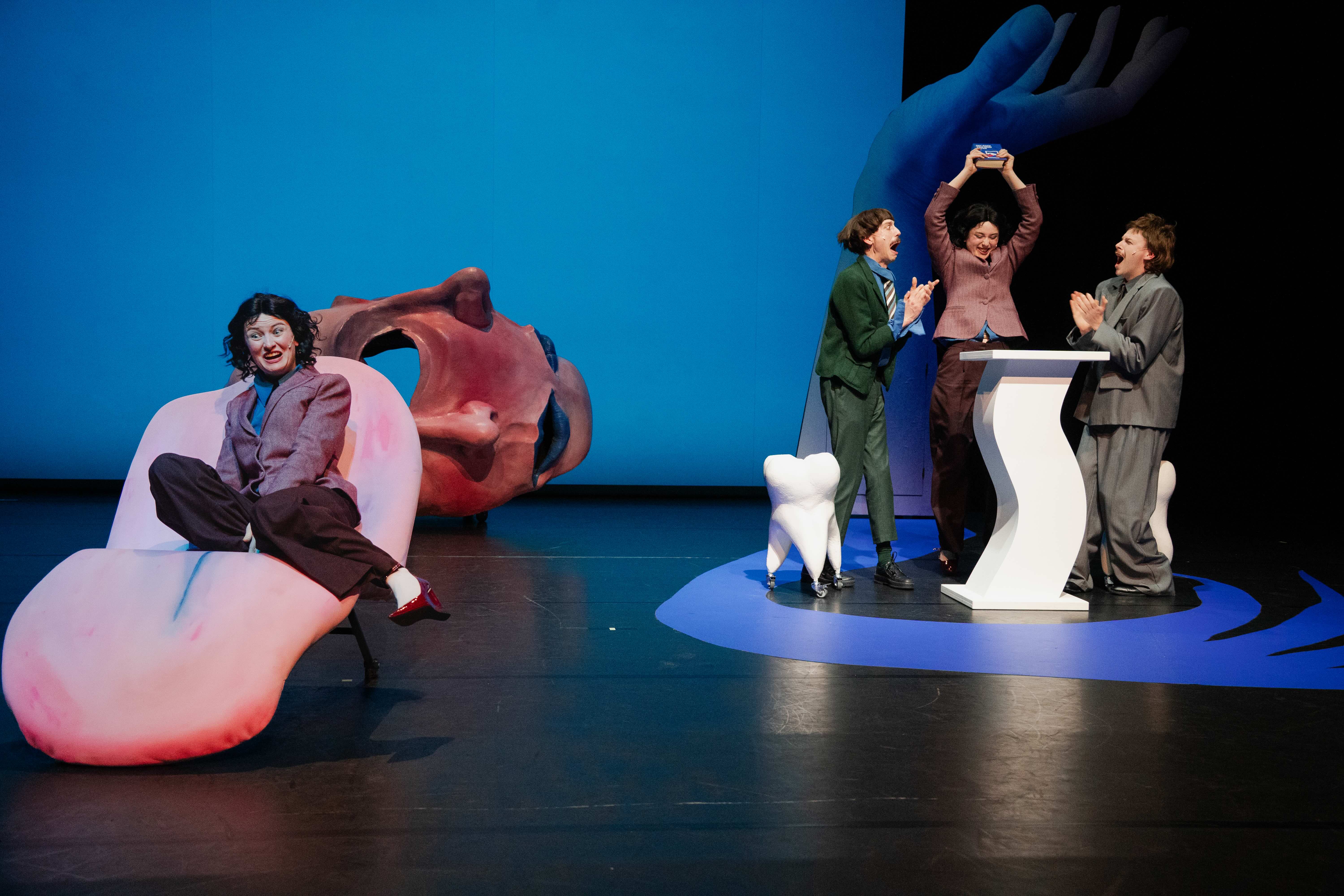 Four performers on a colorful stage during a performance of Copyriot at KVS.