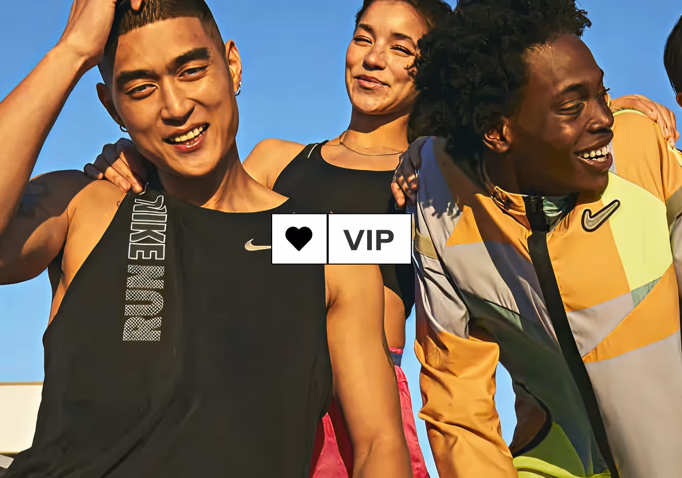 Three smiling people in Nike athletic apparel under a clear blue sky with a VIP heart overlay.