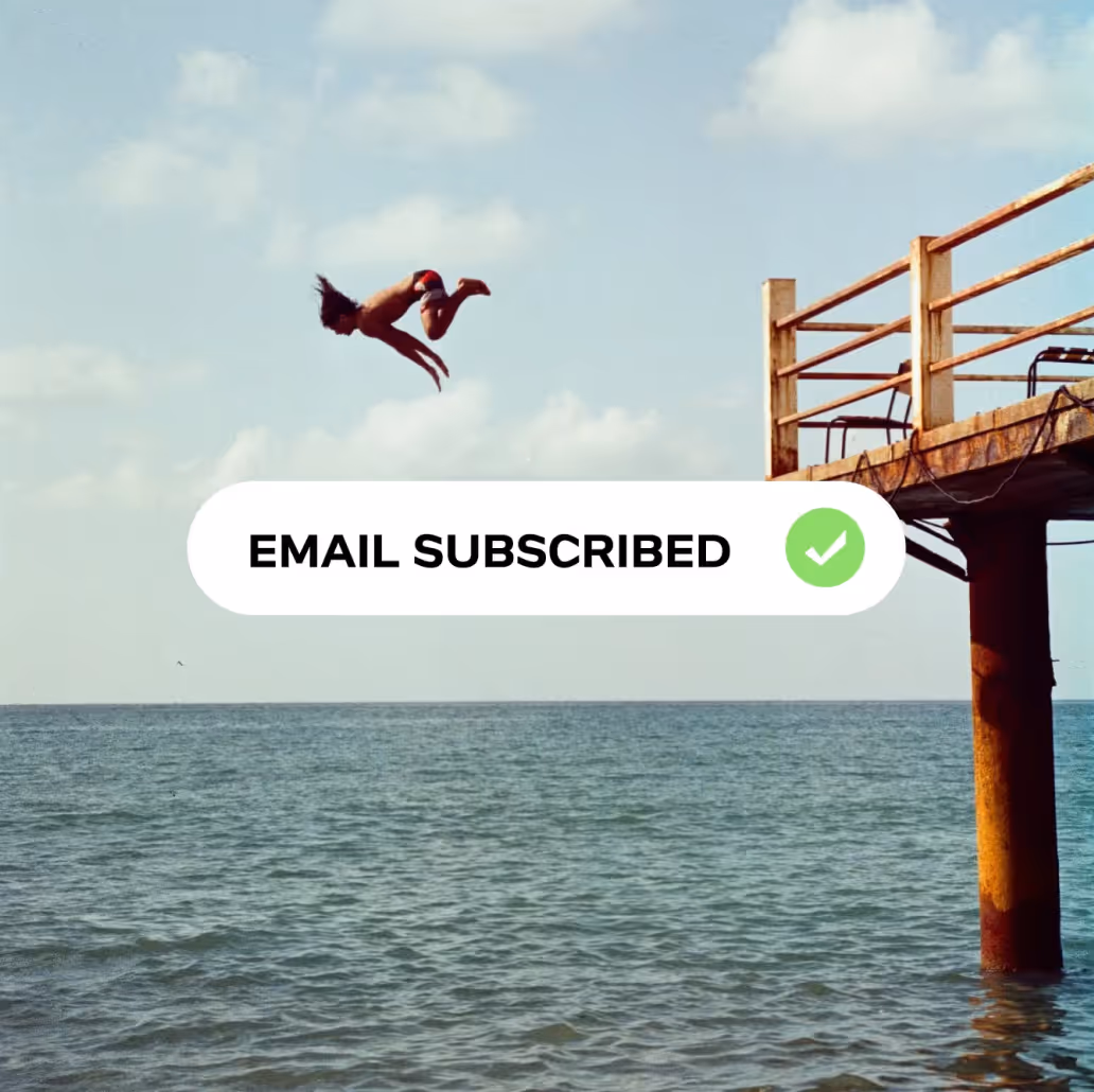 Person diving off a wooden pier into the ocean under a partly cloudy sky with a confirmation message reading 'EMAIL SUBSCRIBED' and a green checkmark.