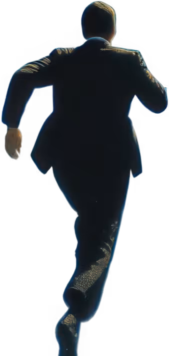 Man in a dark suit running away, shown from the back.