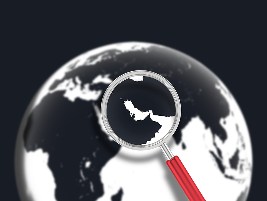 Conceptual 3D illustration of a magnifying glass with a red handle focusing on the Arabian Peninsula (Middle East) on a blurred black and white globe, symbolising regional market analysis and global search.