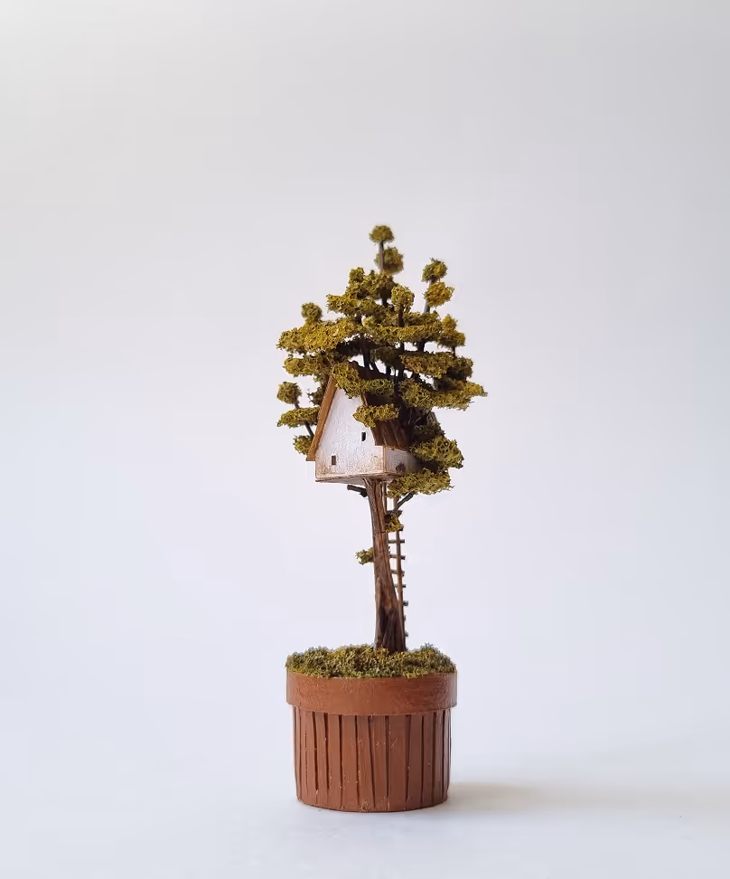 Collection of handmade miniature houses in ceramic pots, decorative indoor garden sculptures and tiny architecture by Michael Davydov