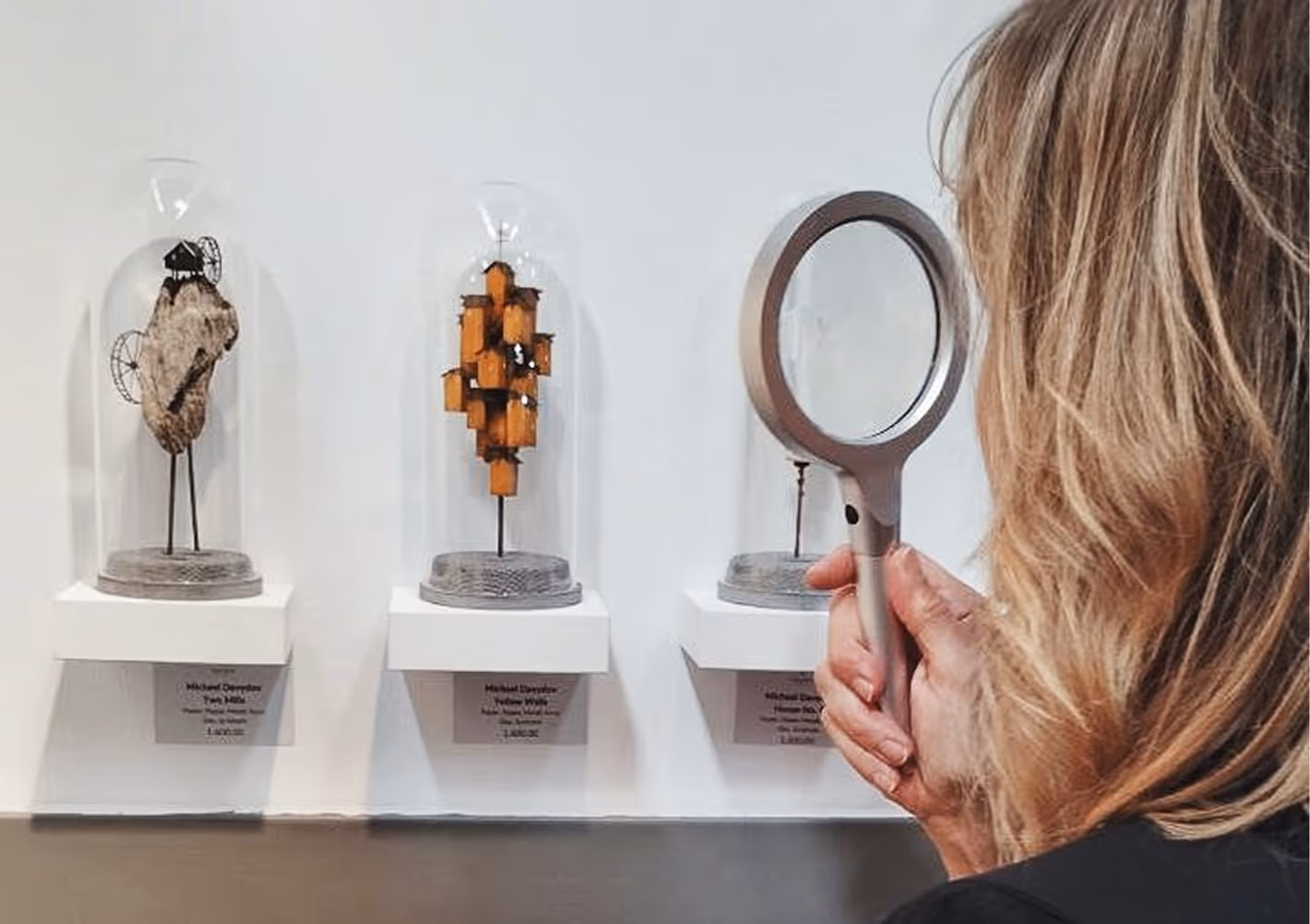 Artist Michael Davydov presenting his unique miniature sculptures during an art exhibition gallery event