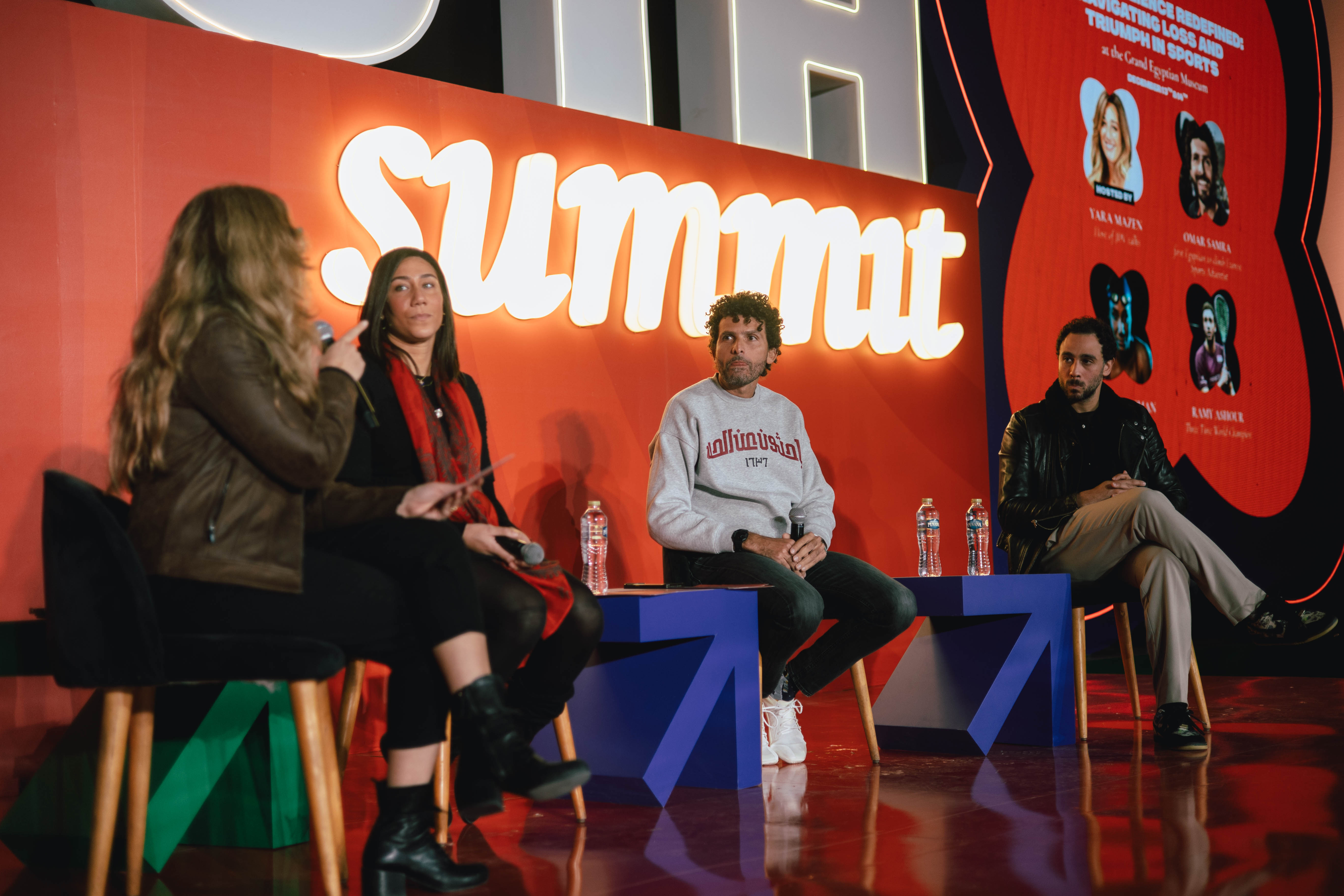 A panel talk on the red stage at UTH 2024