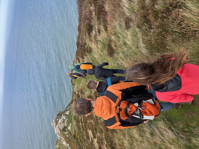 Family hiking on the Devon coastline