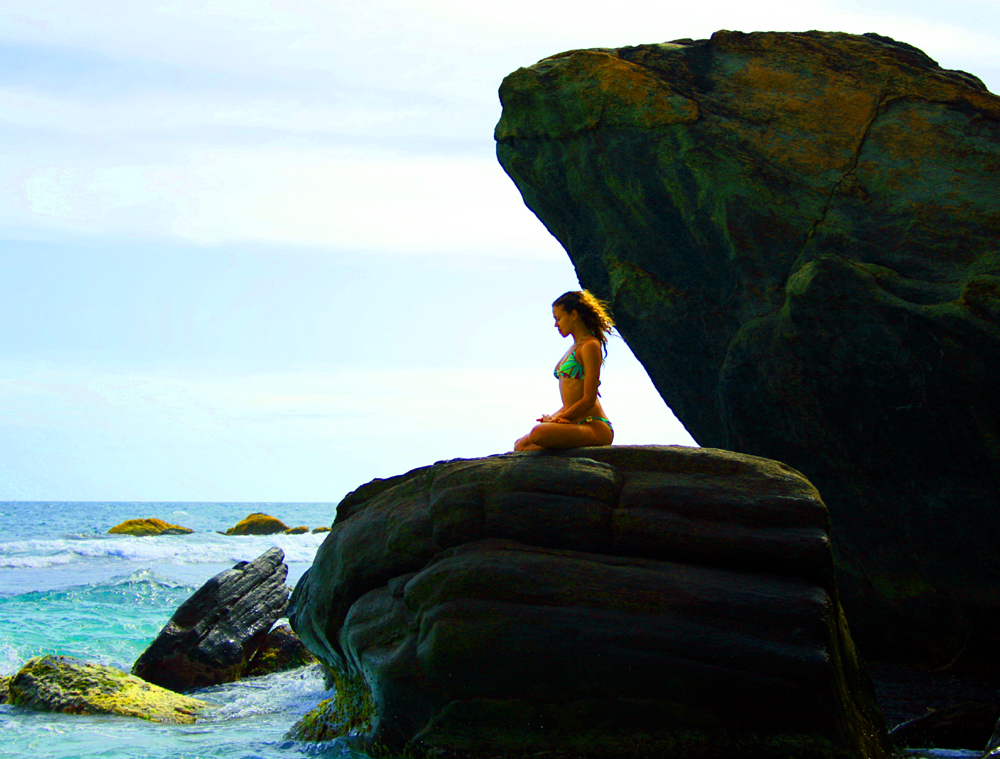 Mercedes meditating on a sea rock on Sri Lanka's south coast