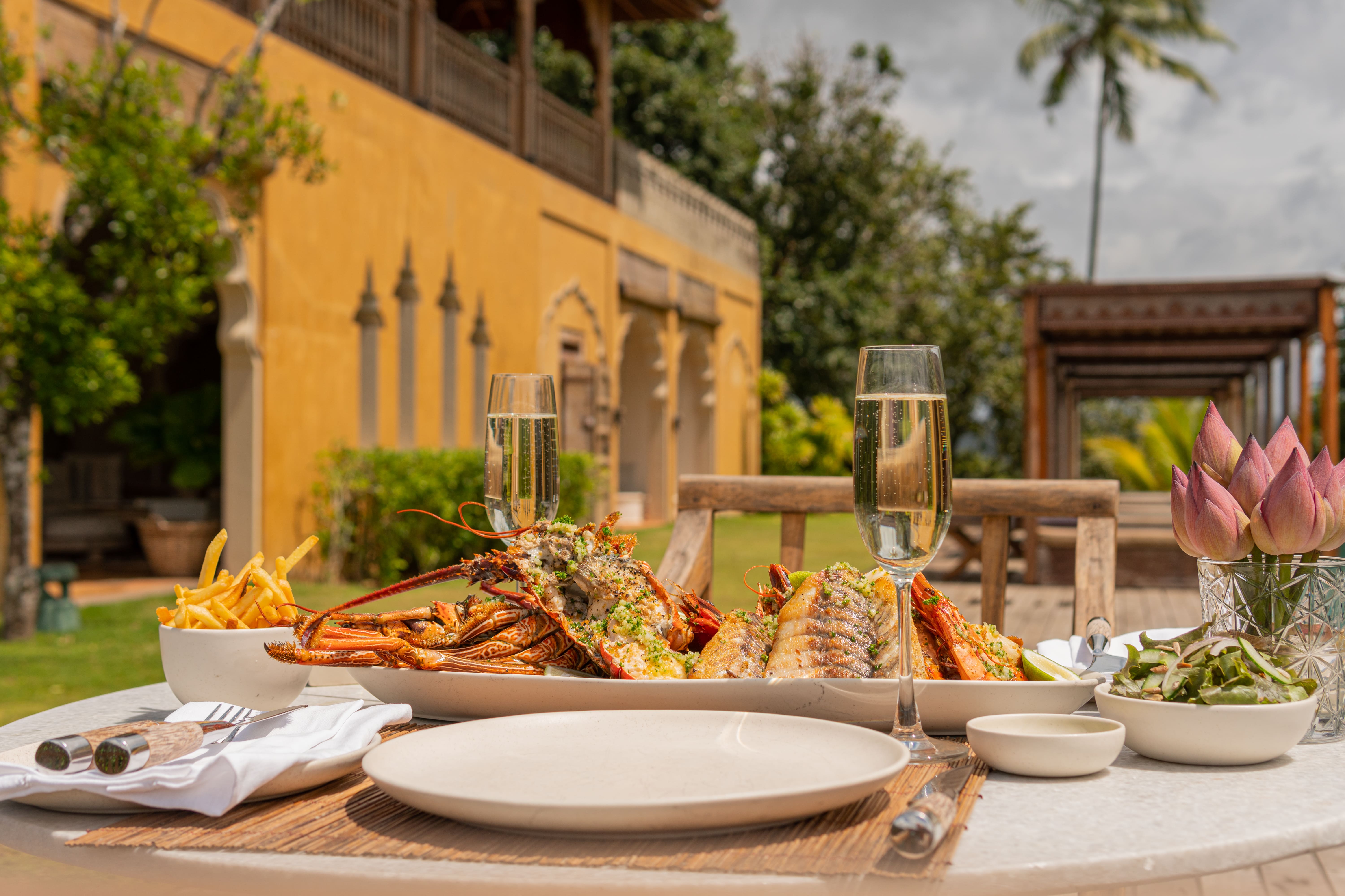 A seafood platter of lobster, prawns and fish with champagne in the garden at Malabar Hill