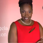 Smiling woman with braided hair wearing a red dress and gold necklace against a pink background.