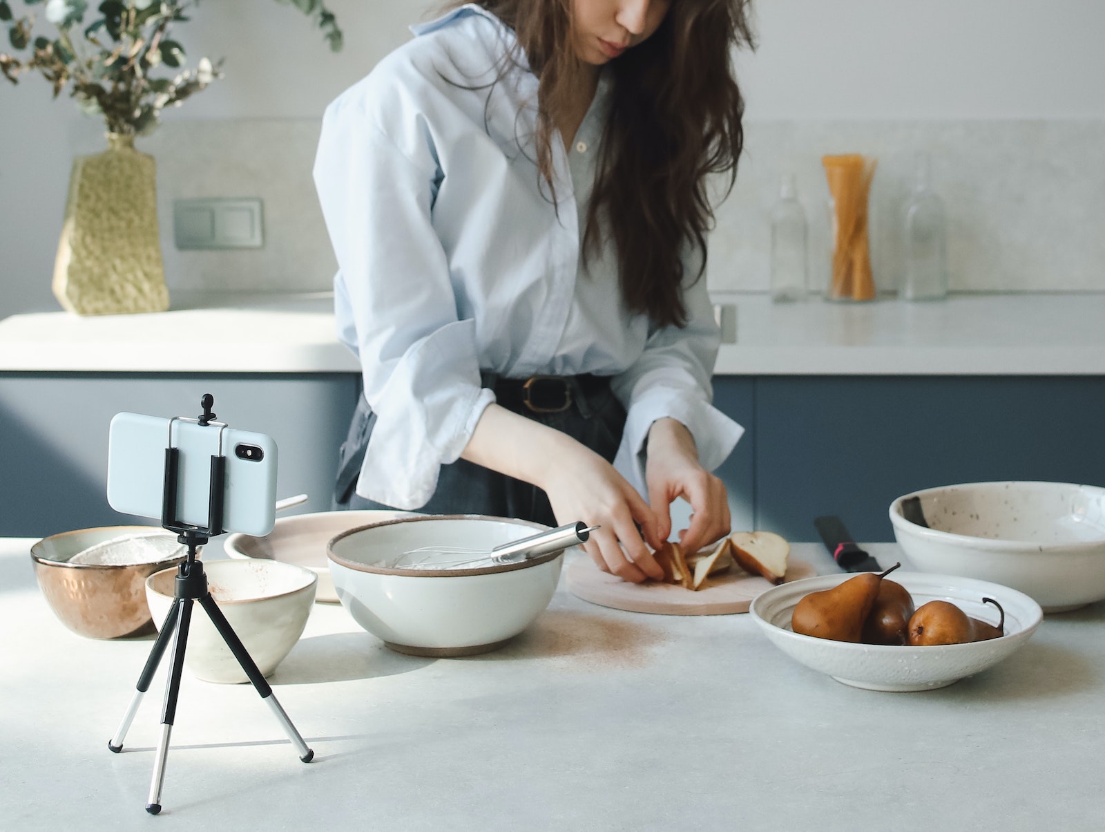 person filming cooking