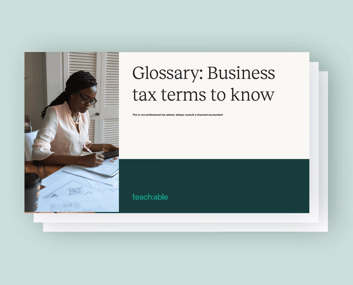 Cover page titled Glossary: Business tax terms to know with photo of woman calculating at a desk.