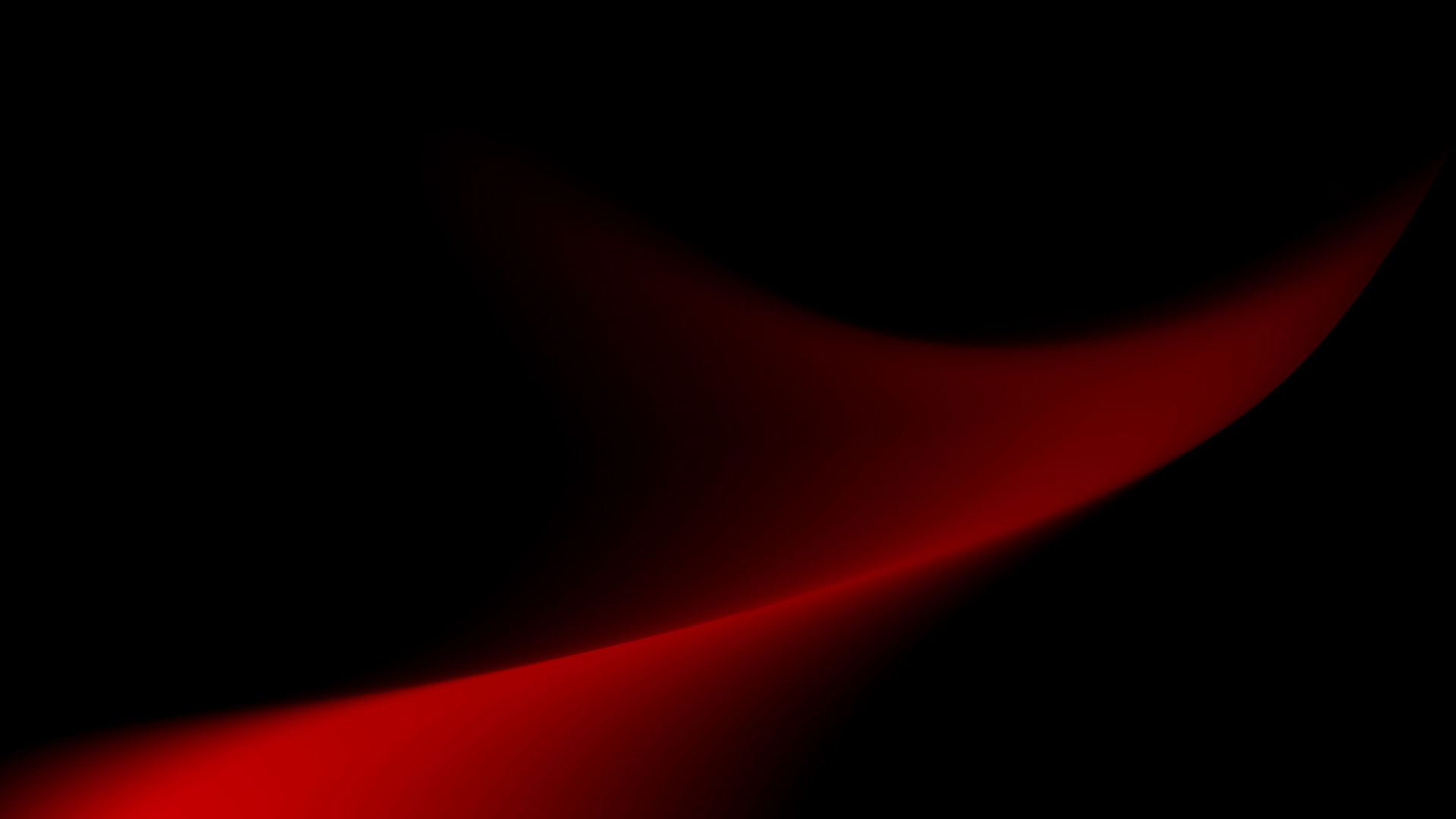 Abstract red wave shape fading into black background.