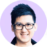 A man wearing glasses and a black shirt.