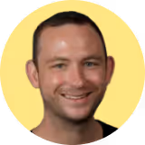 A man with a black shirt and a yellow circle around his head.