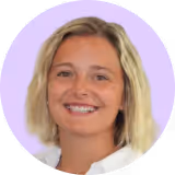 A woman with blonde hair smiling for the camera.