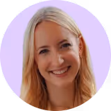 A woman with blonde hair smiling for the camera.