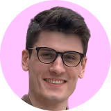 A man wearing glasses and a brown shirt.