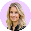 A woman with blonde hair and a black shirt.