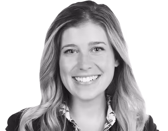 A woman with blonde hair and a smile on her face.