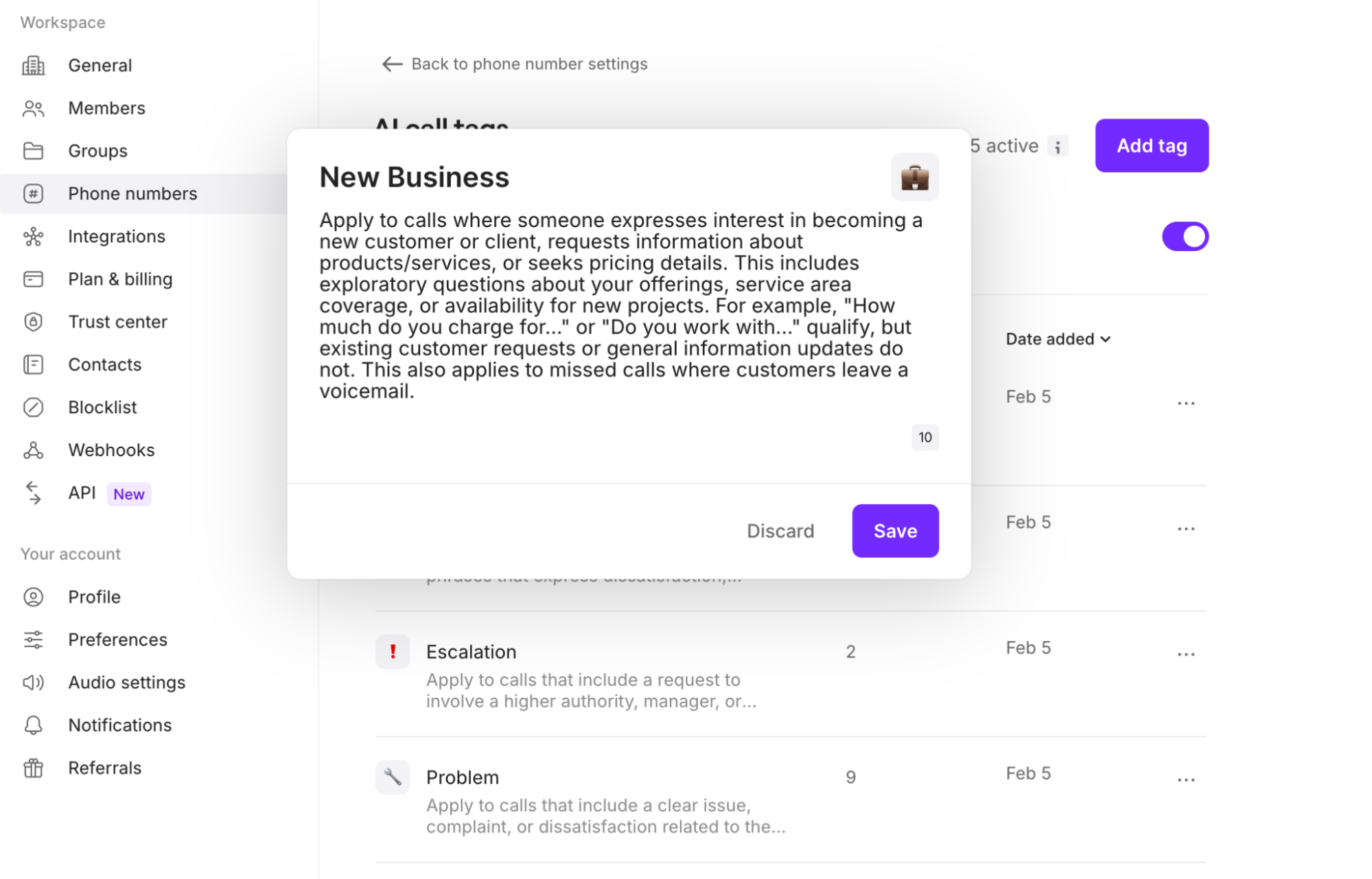 User interface of a call tags settings page showing a pop-up description for the tag 'New Business' explaining it applies to calls expressing interest in becoming a new customer or seeking product information, with options to discard or save.