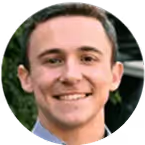 Portrait of a young man with short dark hair smiling.
